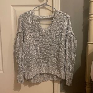 cute sweater with cut outs on the back!